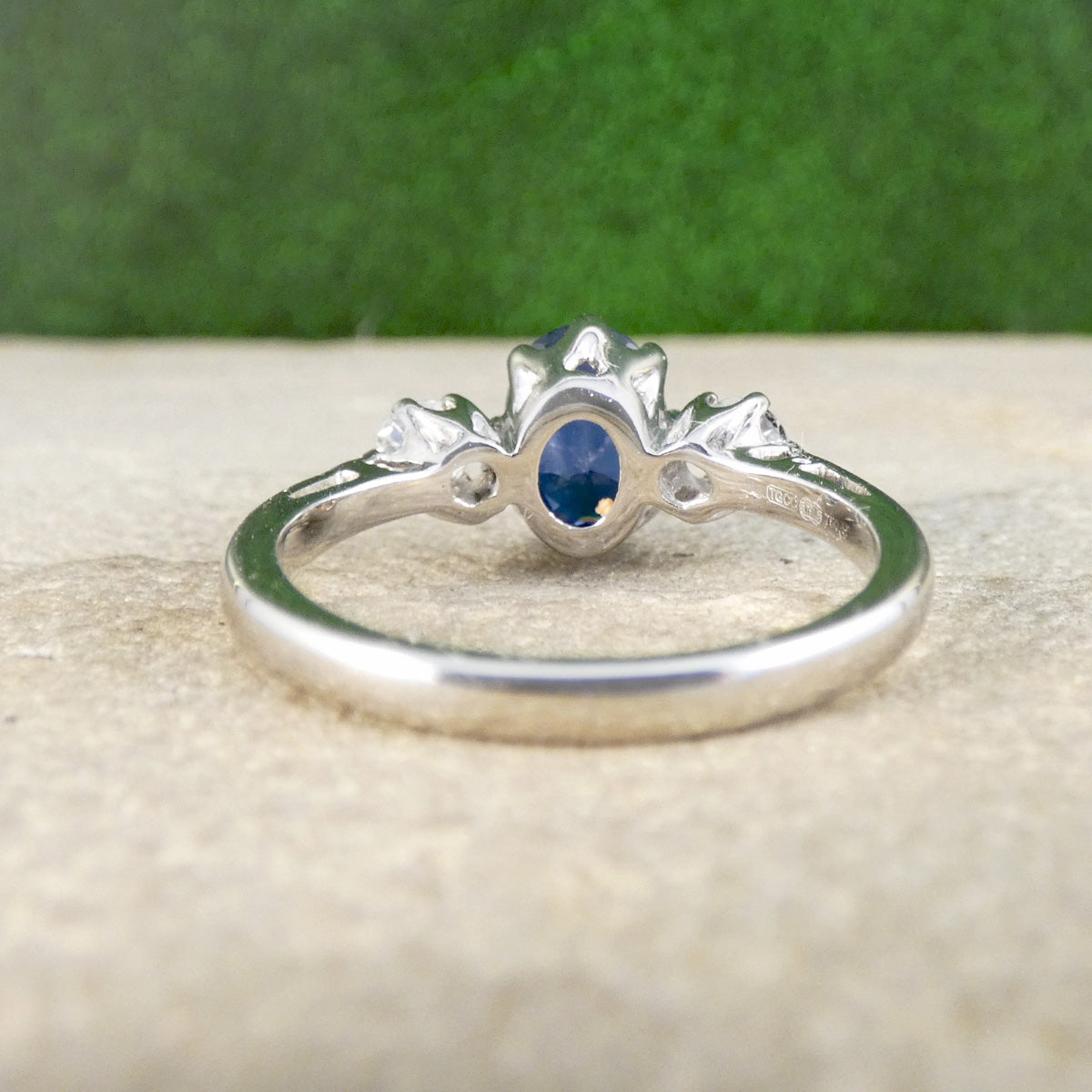 Back view of a Sapphire and Diamond classic three stone ring