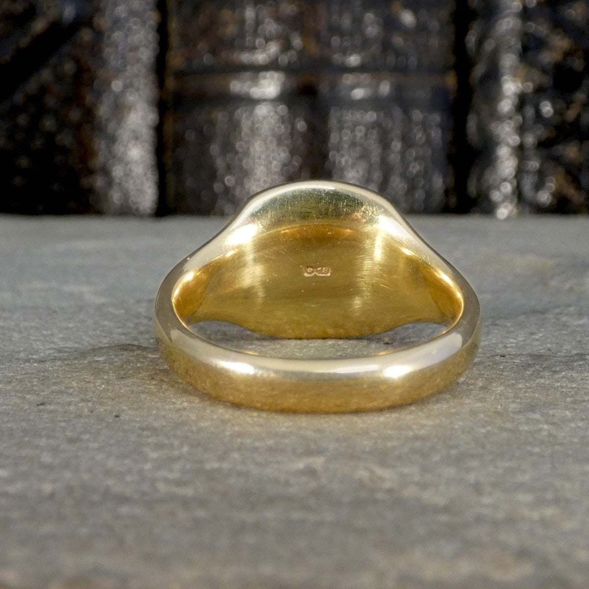 Back view of 18ct Yellow Gold signet ring with the 18 mark on the back of the head.