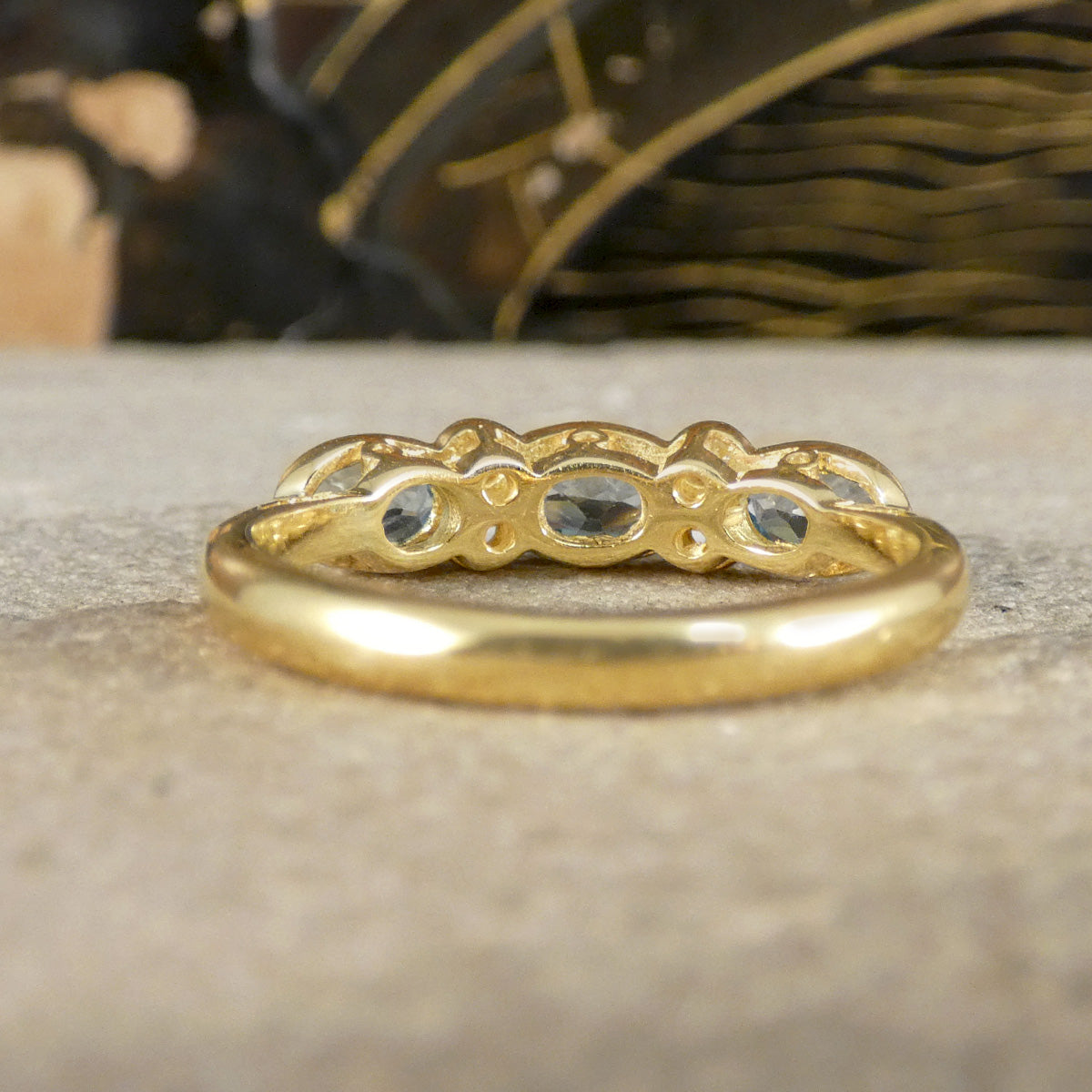Back view of Blue Topaz and Diamonds ring in Yellow Gold