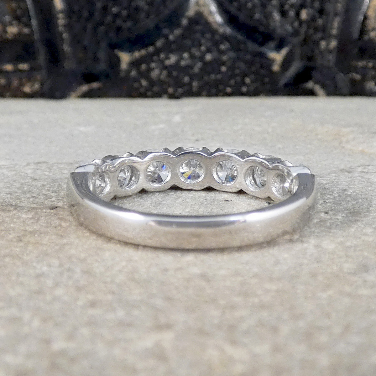 Back view of diamond half eternity ring in 18ct white gold with a plain polished band