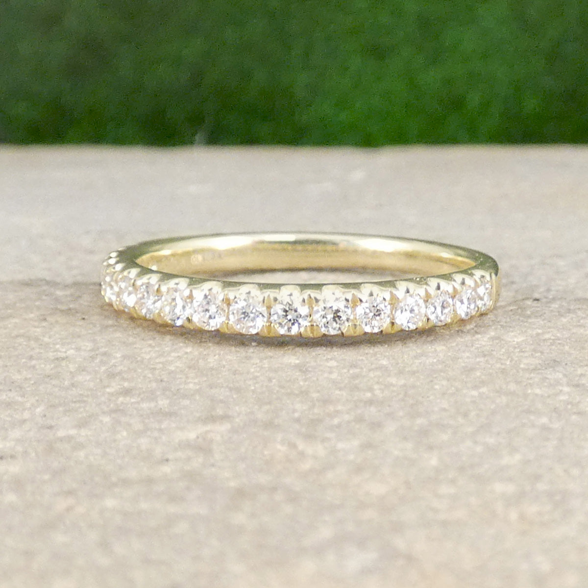 A diamond half eternity ring in yellow gold, perfect stacking ring