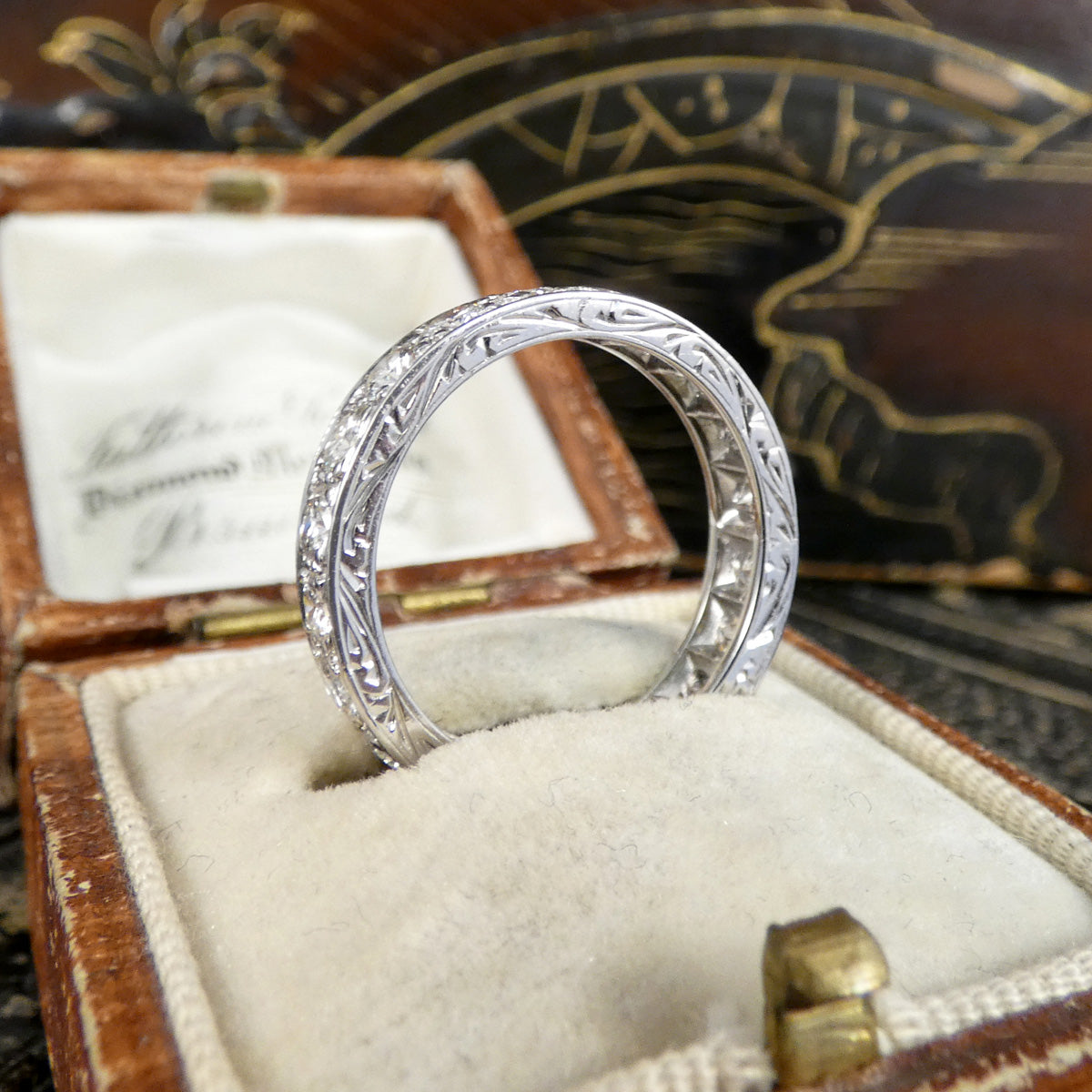 Side view of a full eternity ring in 18ct white gold with a detailed side proilfe