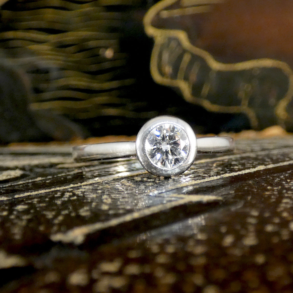 Diamond Solitaire Wedfit Ring in a Rub Over Bezel with a Diamond set Profile.