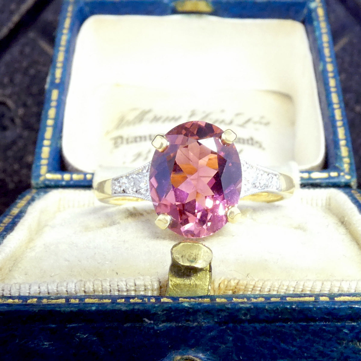 A gorgeous Pink Tourmaline ring with diamond shoulders in 18ct yellow gold.