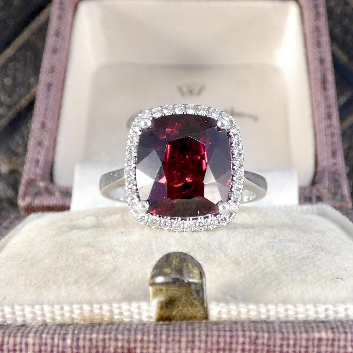 Rhodolite Garnet and Diamond Cluster Ring in 18ct White Gold displayed in a vintage box.