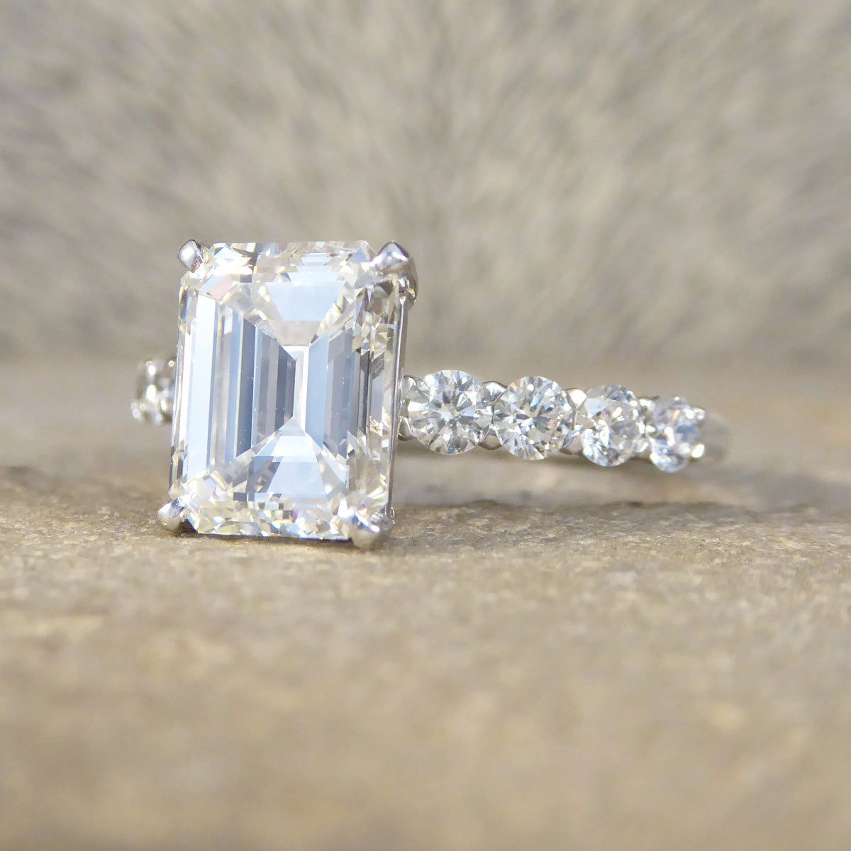 2.60ct Emerald Cut Diamond Solitaire Ring with 0.60ct Diamond Shoulders in Platinum - Wharfedale Antiques