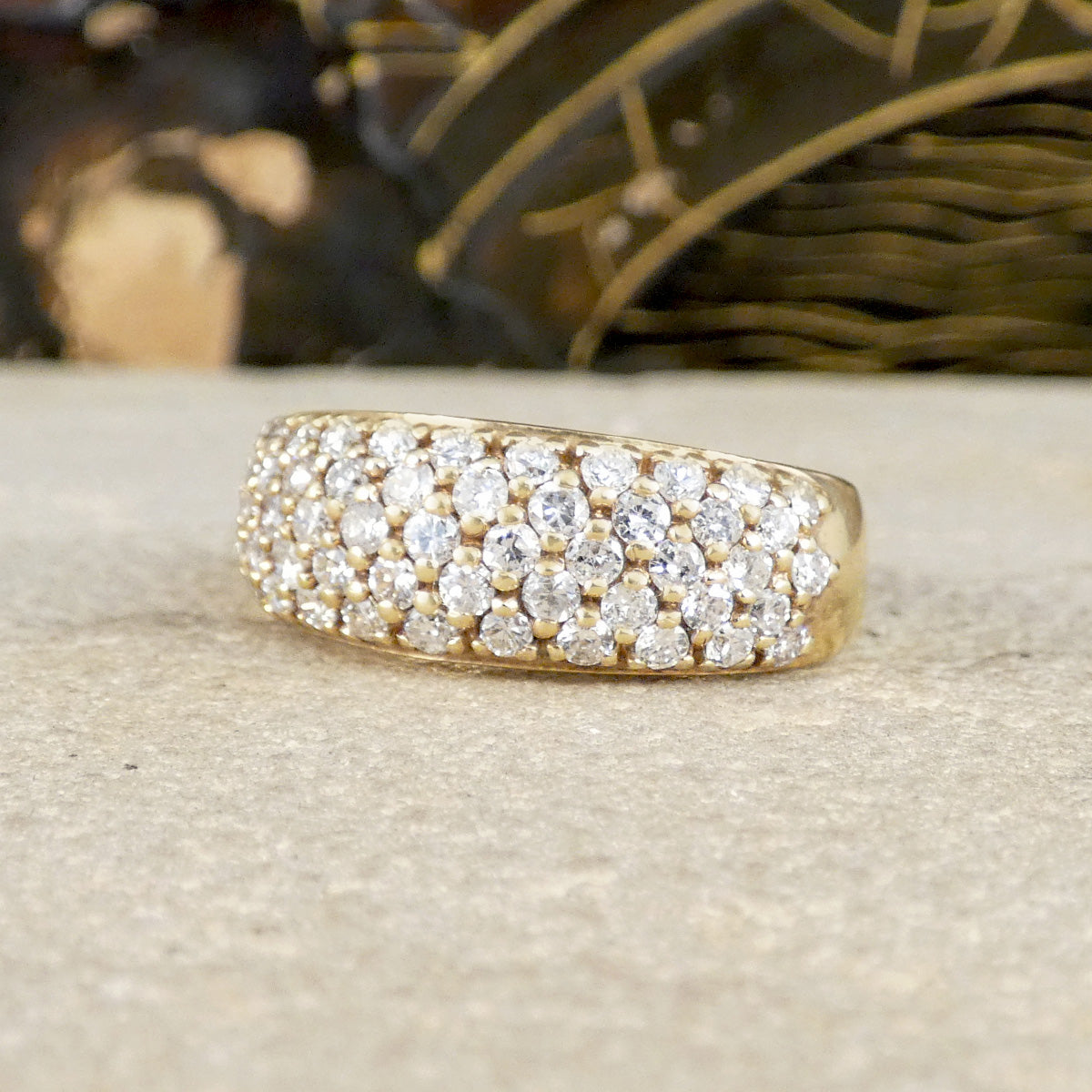 a diamond set domes ring in 9ct yellow gold