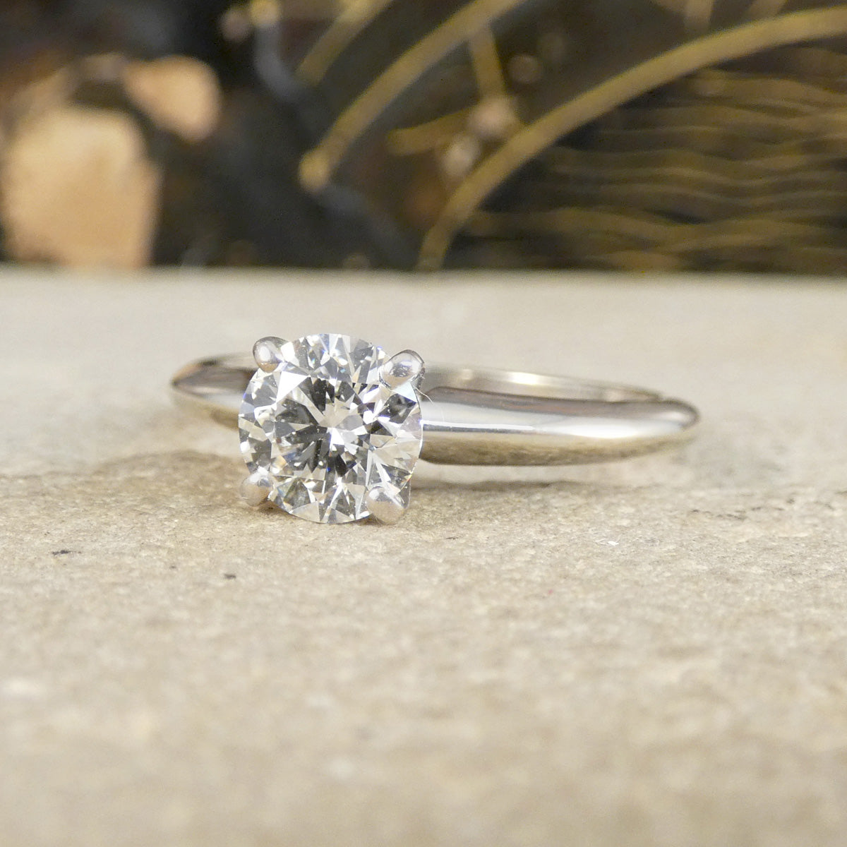 A diamond solitaire high set ring in white gold in a four claw setting