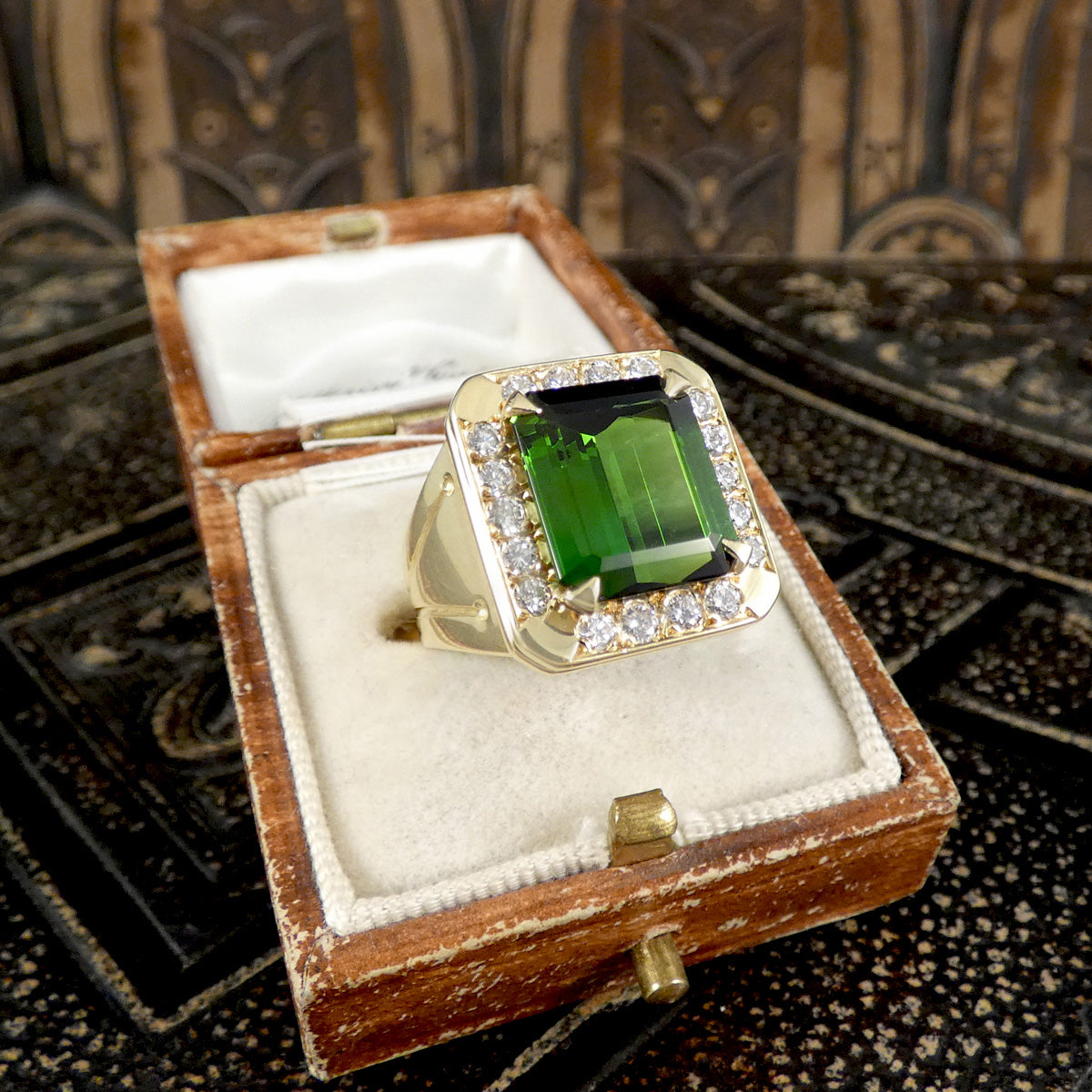 A gorgeous vintage ring displayed in a vintage box, showcasing the bold colour and striking appearance. 