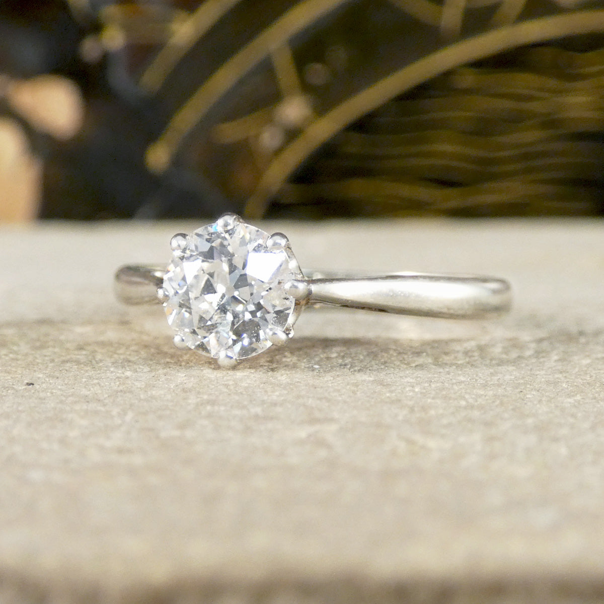 An old cut diamond solitaire ring in 18ct white gold and platinum