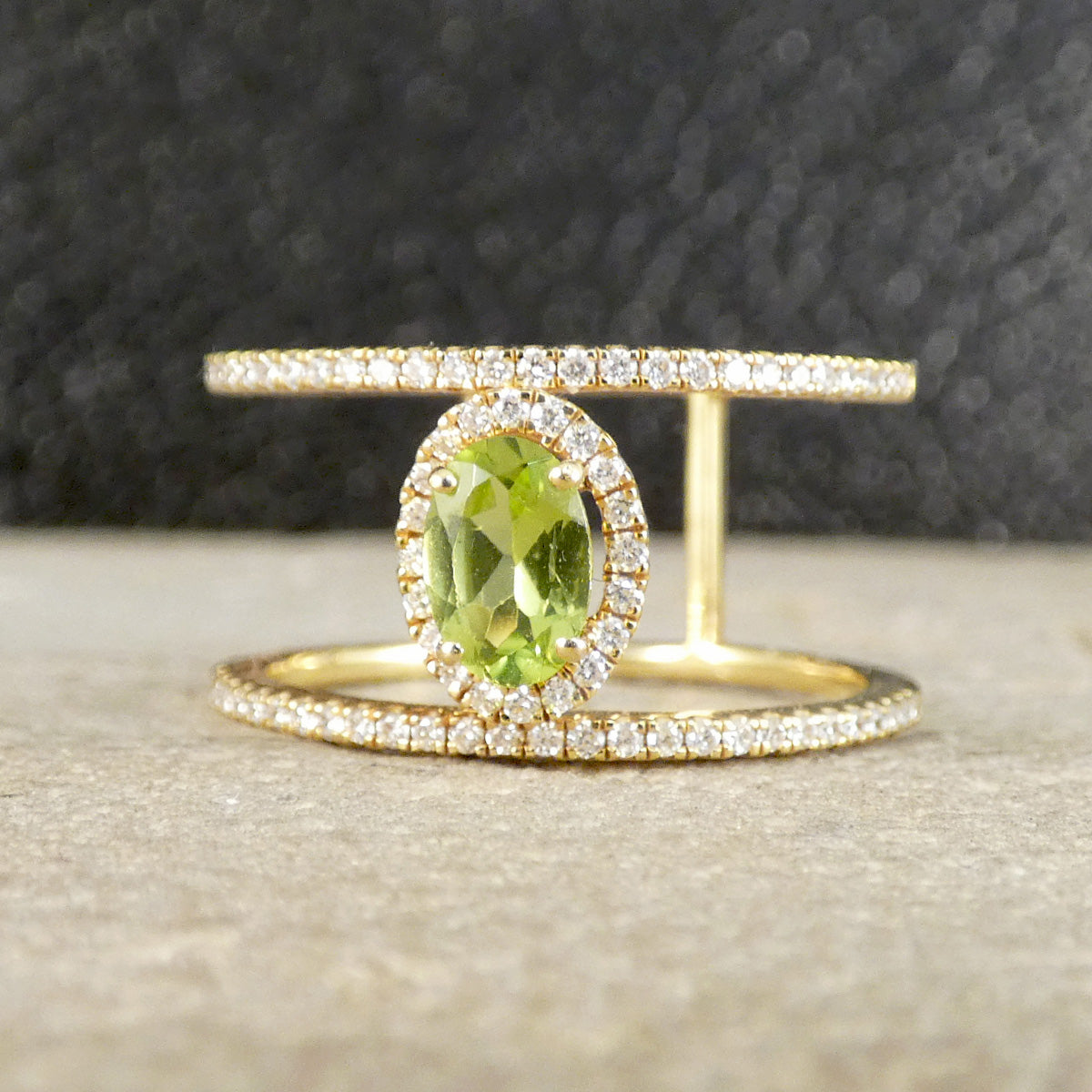 Peridot and Diamond cluster ring with diamond set spacers in 18ct white gold 