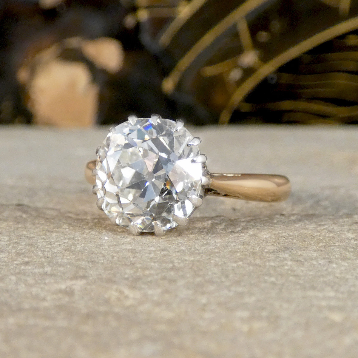 An Old Cushion shaped Mine cut diamond solitaire ring. 