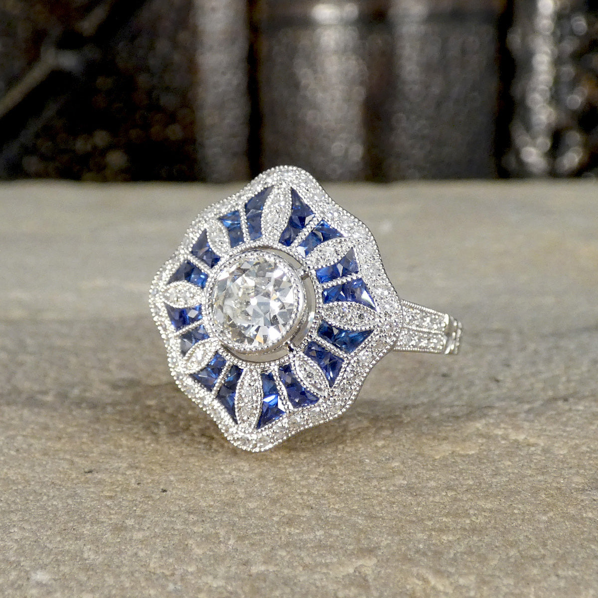 Art Deco Inspired Diamond and Sapphire Cluster Ring in Platinum showing bright and beautiful hues.