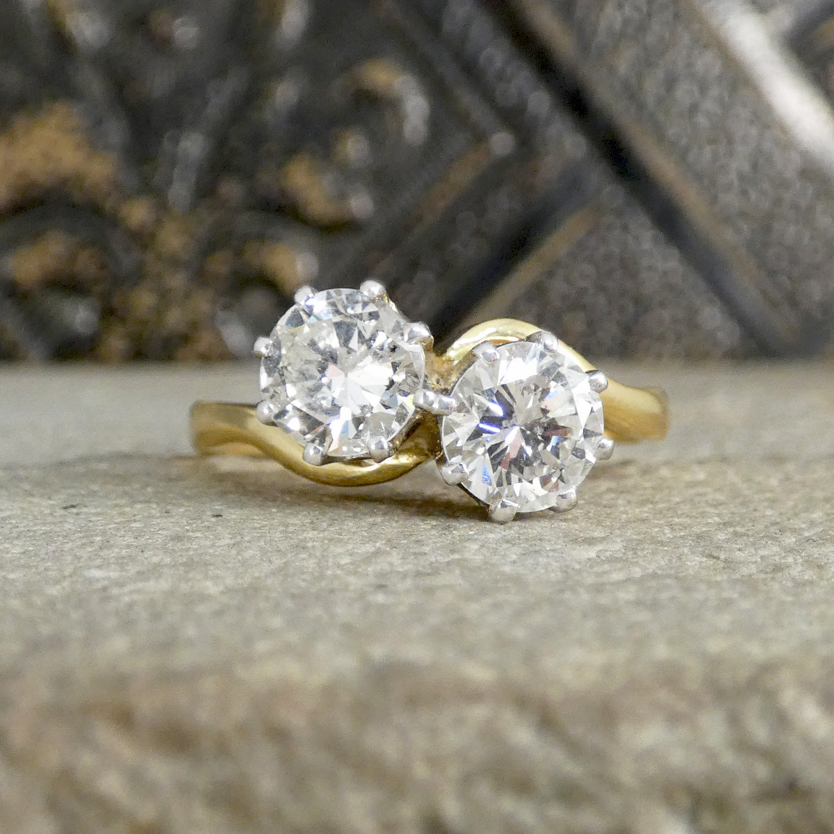 a diamond toi et moi ring in yellow gold