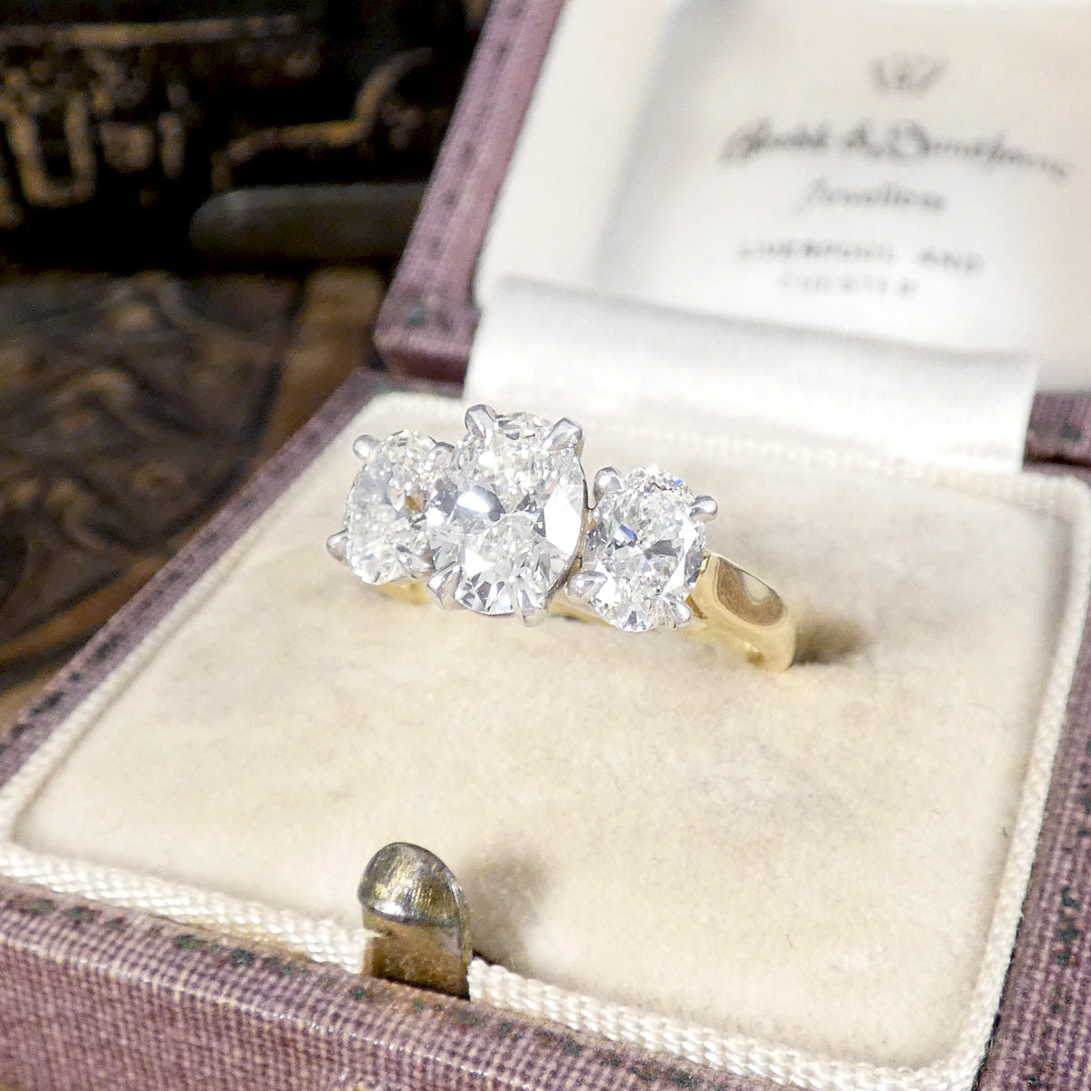 A gorgeous oval cut diamond three stone ring, the perfect engagement ring with a wedfit design allowing it to sit flush with a wedding band.