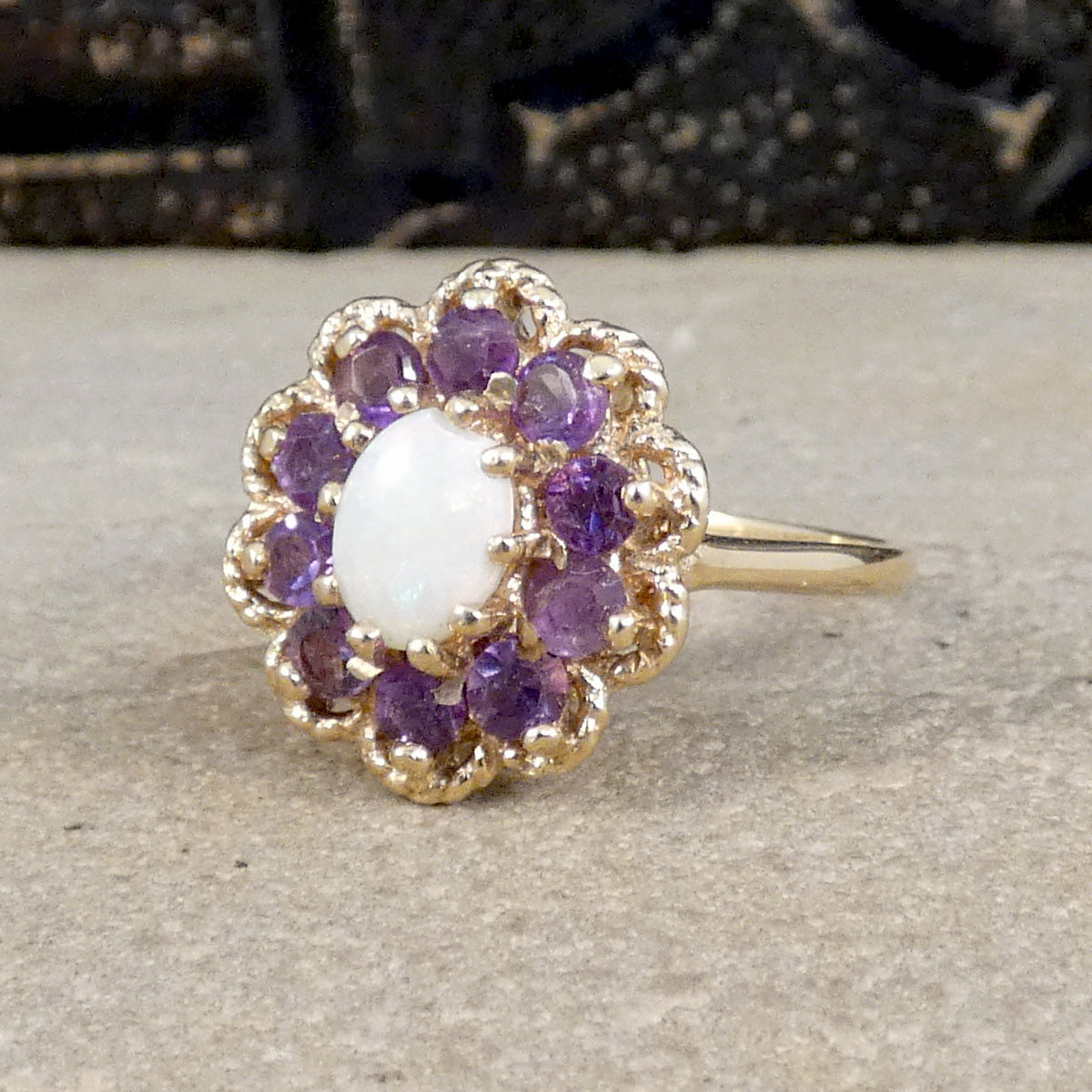 Vintage Opal and Amethyst Cluster Ring in 9ct Yellow Gold with Gold Rope Edge Detail. Amethyst showing bright purple colour with the opal showing a white milky  hue.