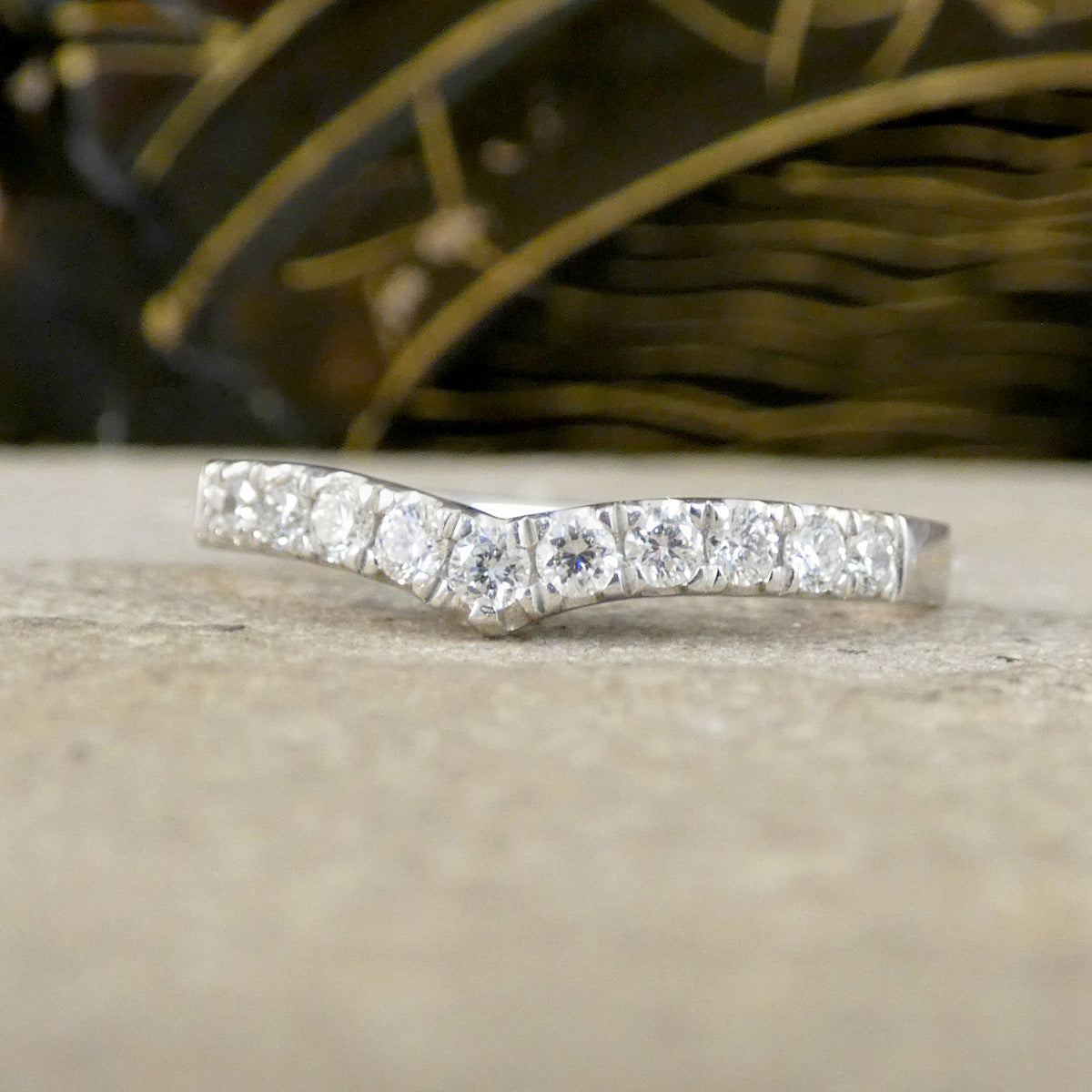 A diamond set wishbone ring in Platinum.