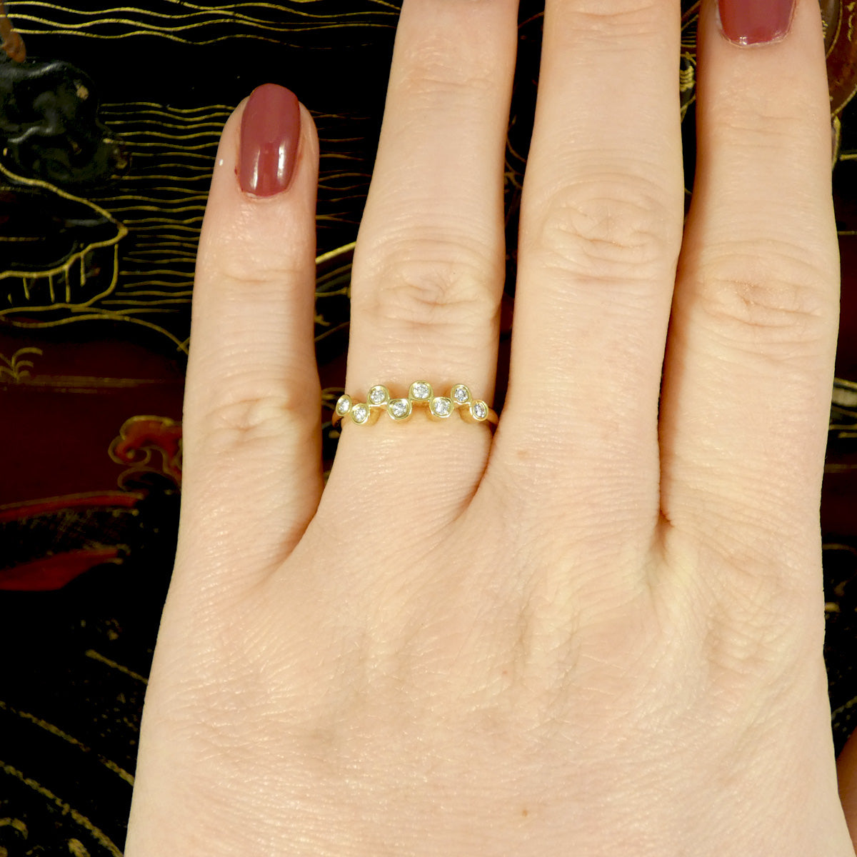 Brilliant cut Diamonds set in a bubbled band in 9ct Yellow Gold. The perfect stackable ring or to be worn solo. Unique and stand out design. Shown worn on the finger to get a better idea of shape and size.