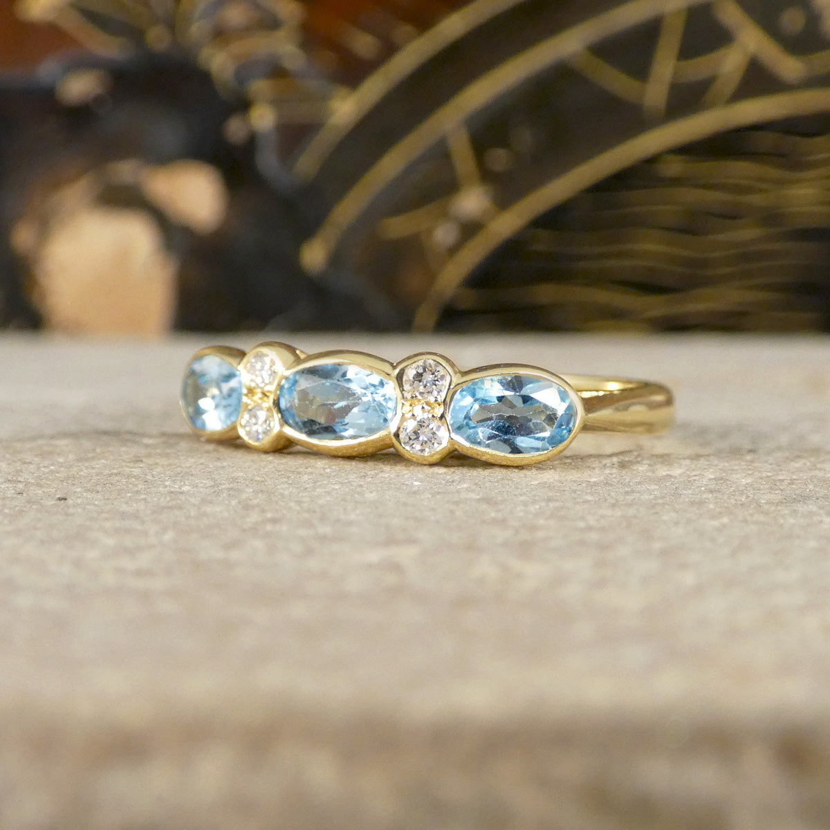 Blue Topaz and Diamonds ring in Yellow Gold