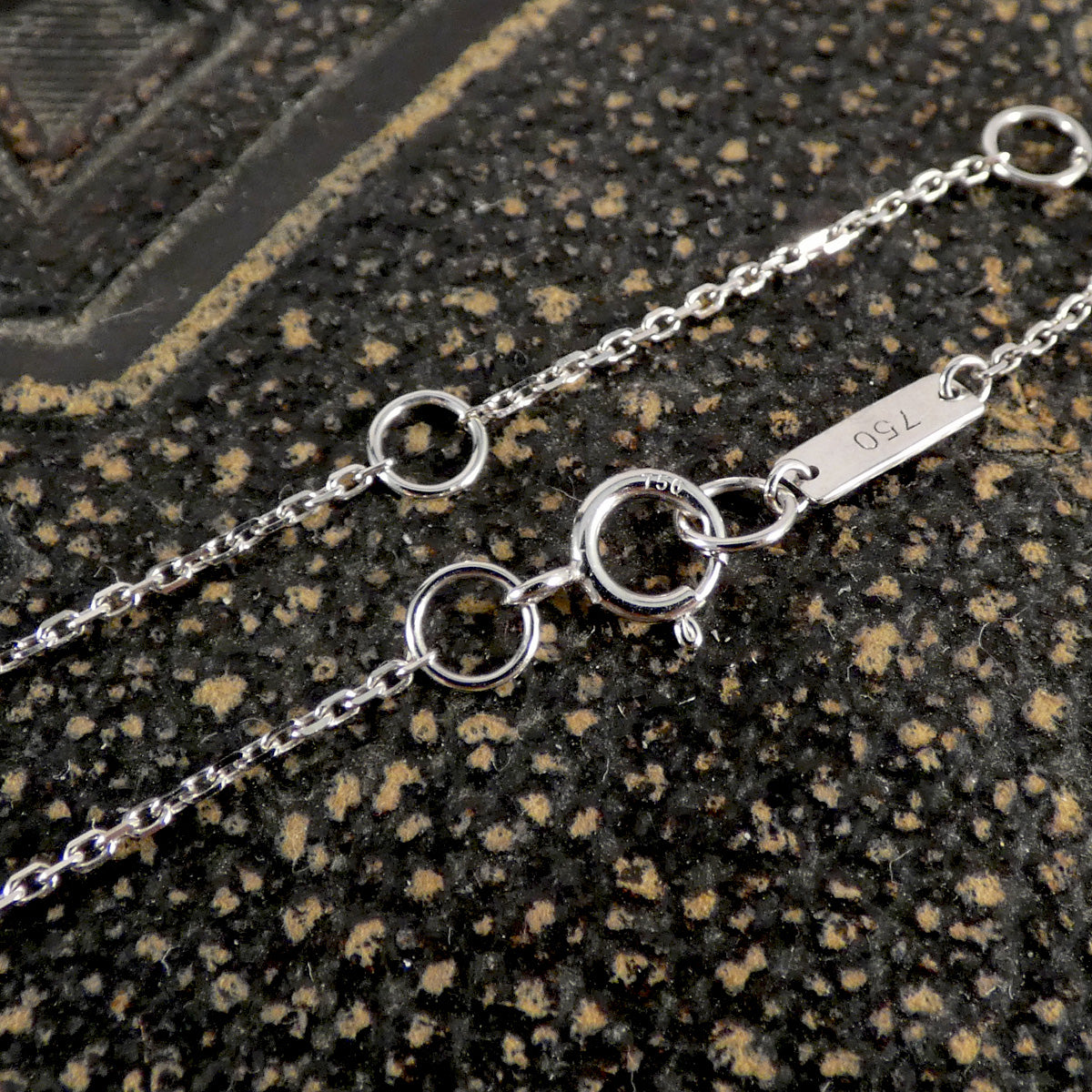 a white gold chain with a bolt clasp