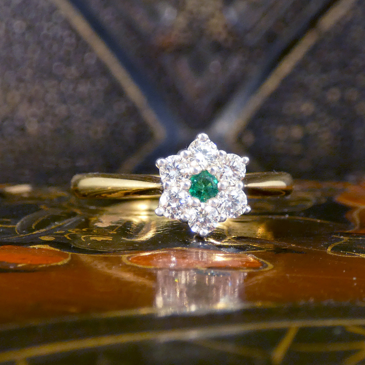 A beautiful and dainty Emerald and Diamond flower cluster ring in 18ct Yellow and White Gold. The perfect gift.