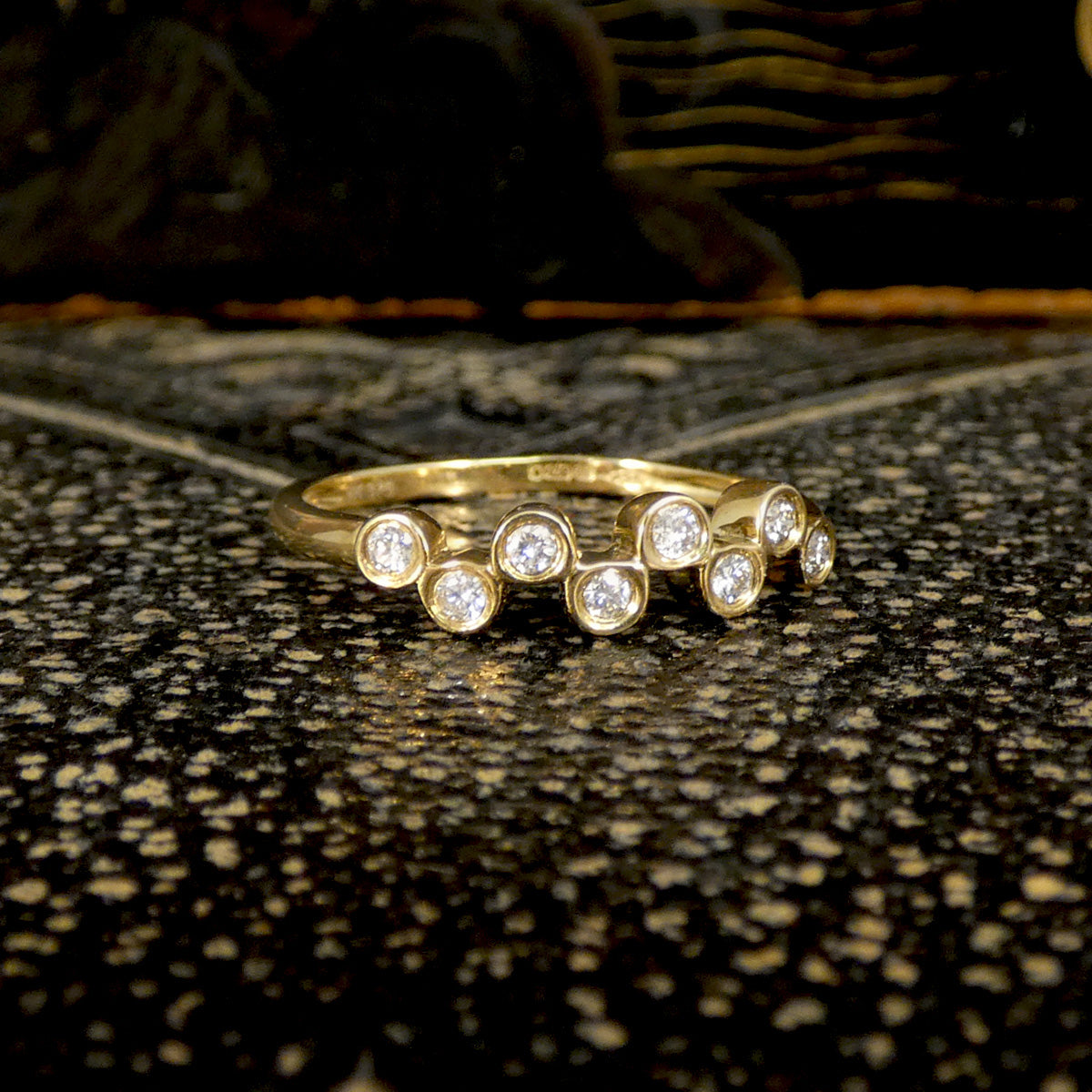Brilliant cut Diamonds set in a bubbled band in 9ct Yellow Gold. The perfect stackable ring or to be worn solo. Unique and stand out design.