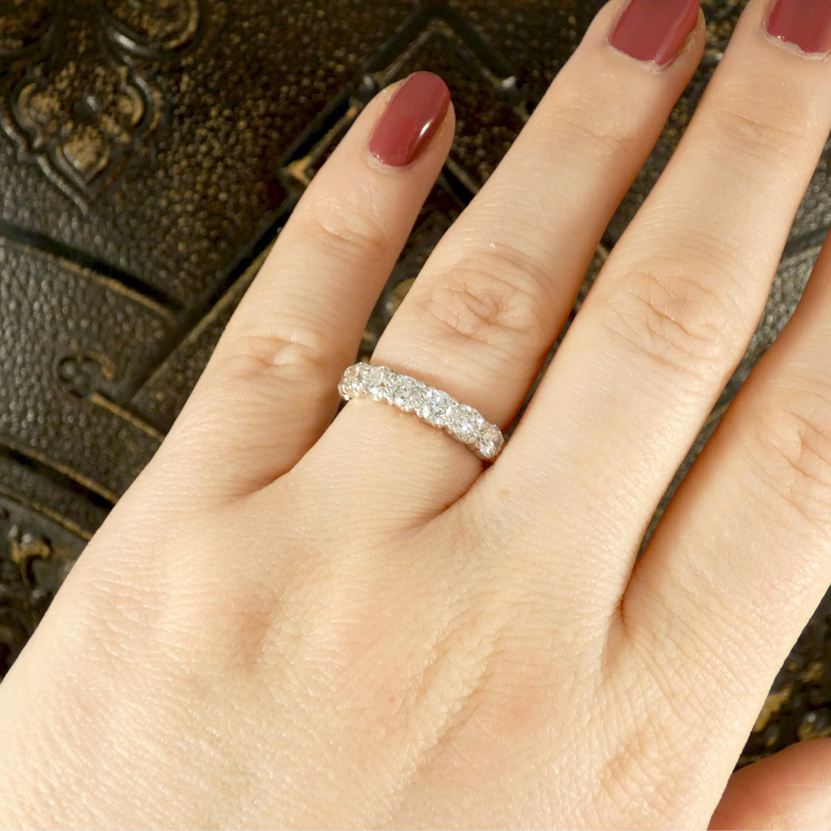 1.40ct Diamond Half Eternity Ring in 18ct White Gold. Displayed on finger featuring a row of brilliant cut diamonds creating sparkle across the whole finger.