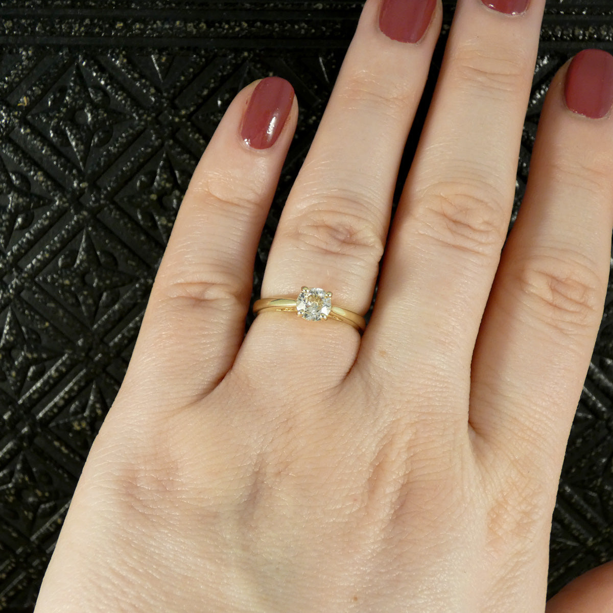 Old European Cut Diamond Solitaire Engagement Ring in Yellow Gold shown on finger for size and colour reference.