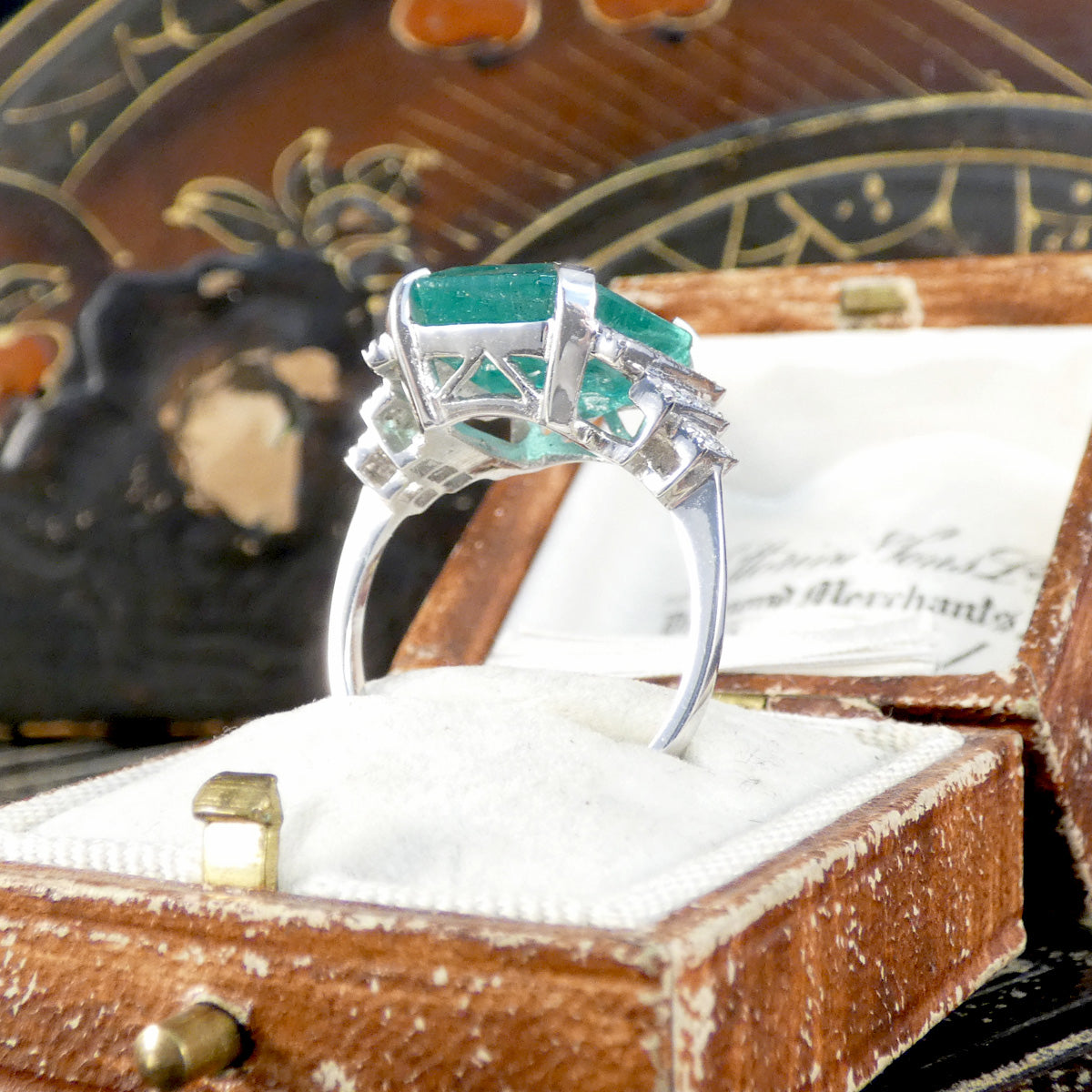 Side view of Emerald ring showing detailed gallery setting.