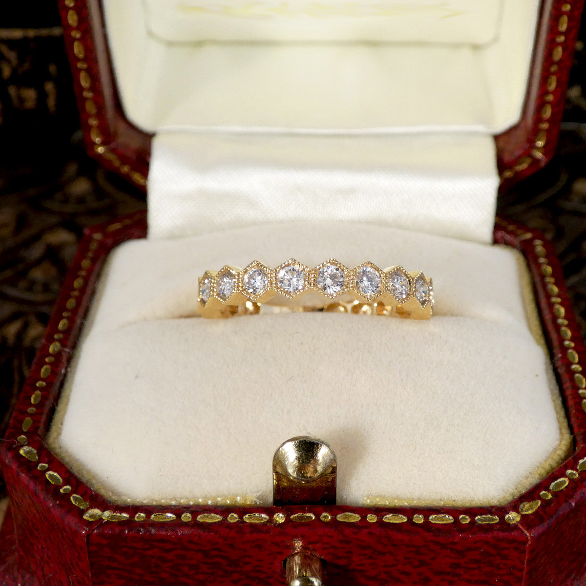 Honeycomb Diamond Half Eternity Ring in 18ct Yellow Gold displayed in a vintage jewellery box.