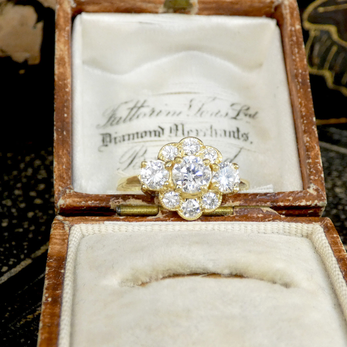 Gold ring with diamonds in an antique jewelry box