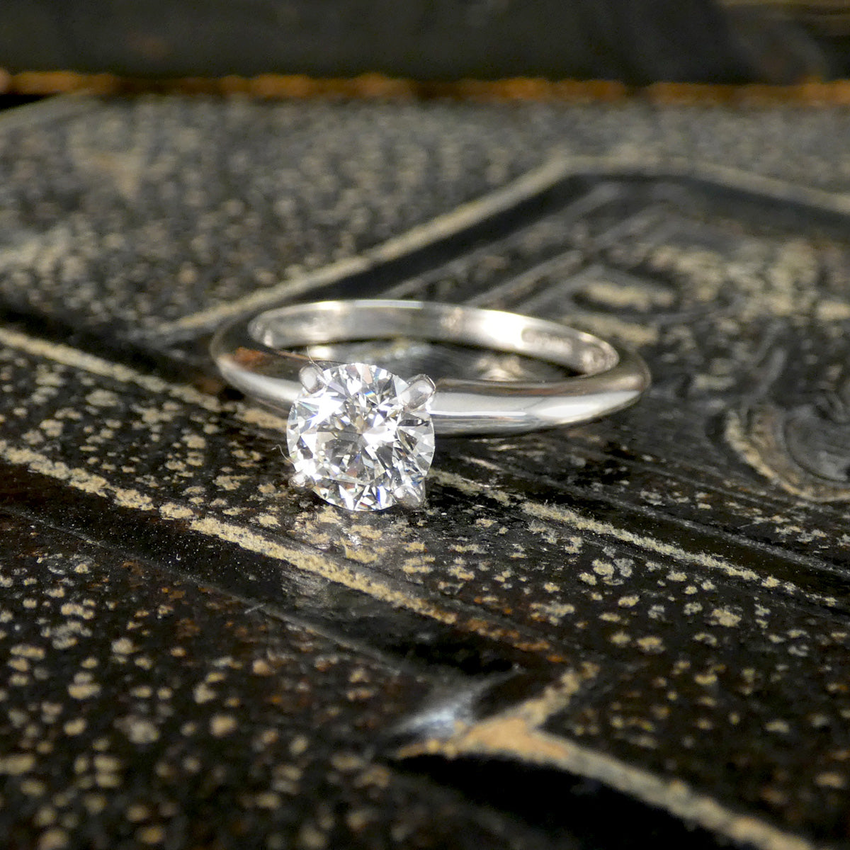 A diamond solitaire high set ring in white gold