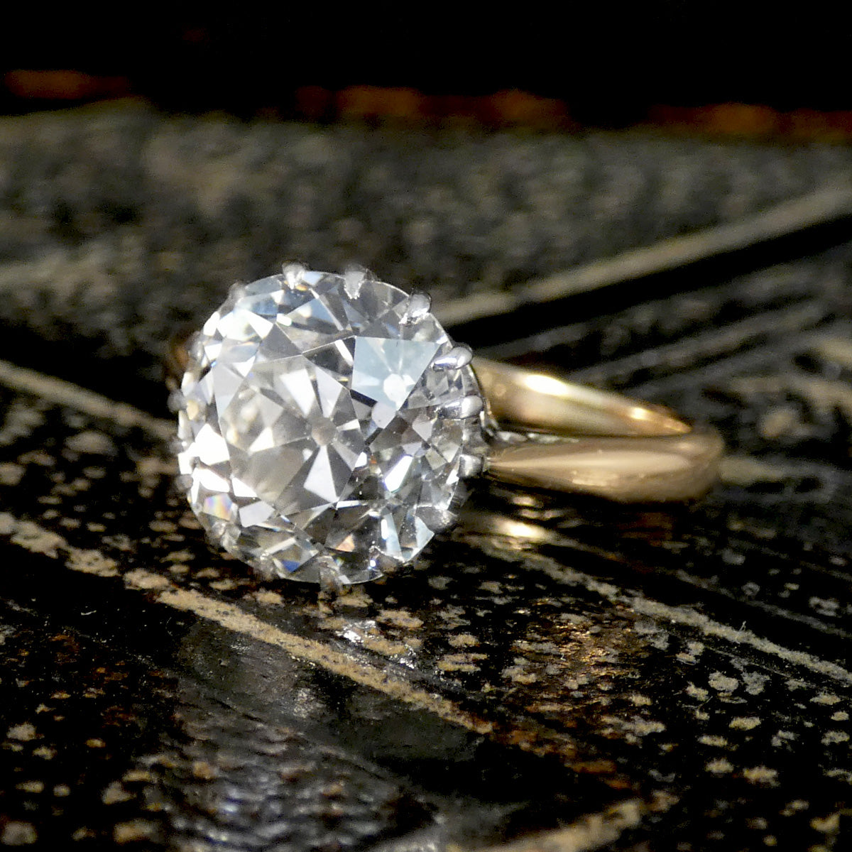 A close up of diamond solitaire engagement ring.