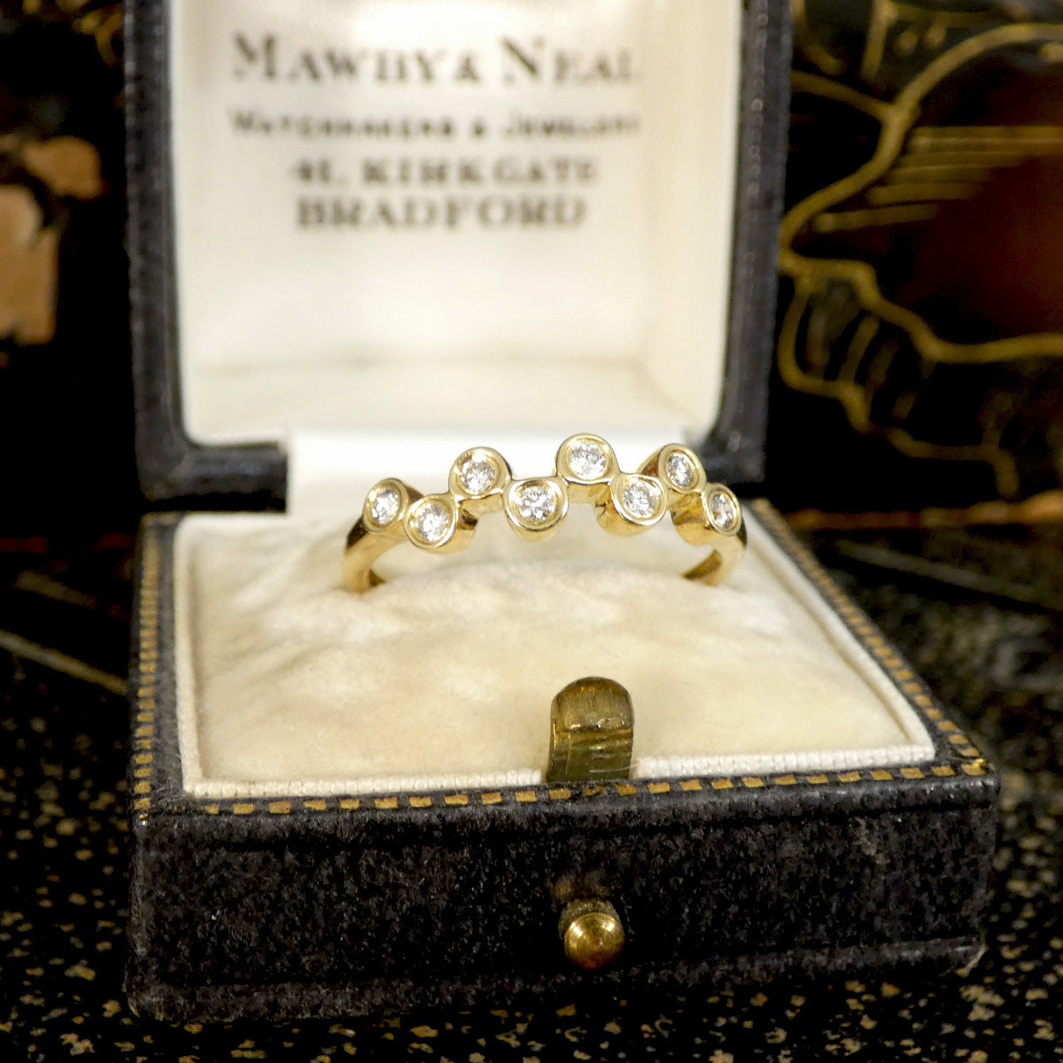 Brilliant cut Diamonds set in a bubbled band in 9ct Yellow Gold. The perfect stackable ring or to be worn solo. Unique and stand out design. Displayed in vintage box, the perfect gift idea.