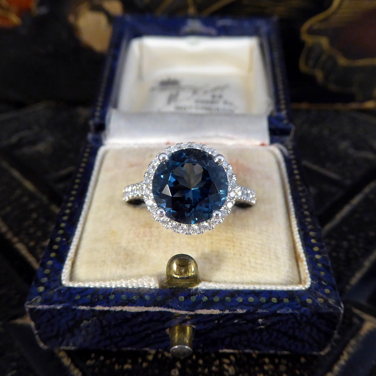 London Blue Topaz and Diamond Halo Cluster Ring in Platinum with Diamond set Shoulders - Wharfedale Antiques