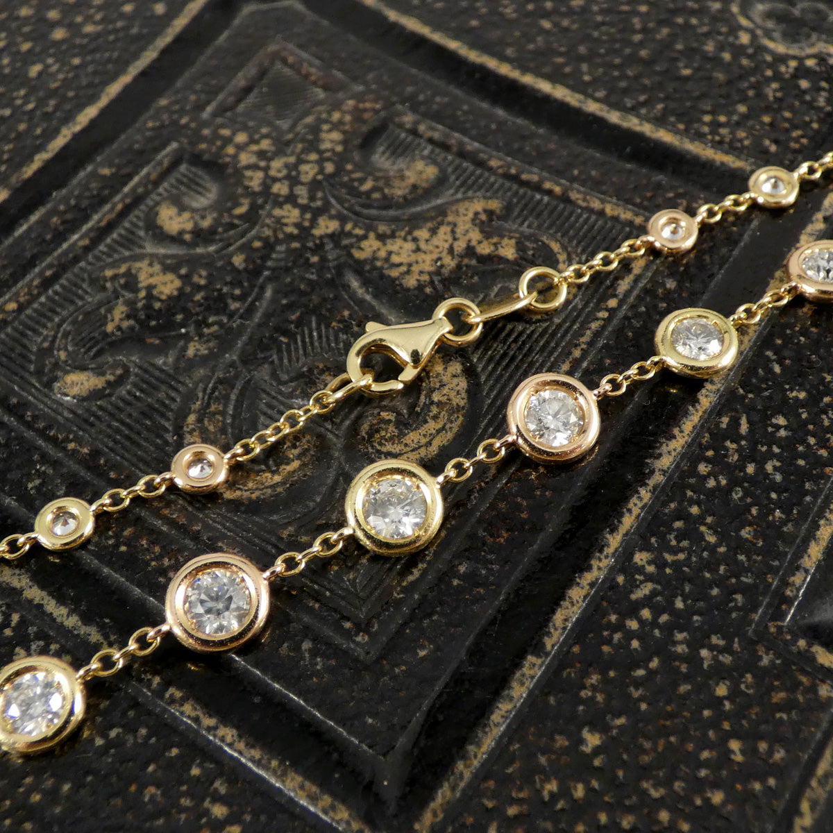 4.55ct Diamond Spectacle Set Spaced Necklace in 18ct Rose and Yellow Gold showing clasp and difference of graduating from largest to smallest diamonds.