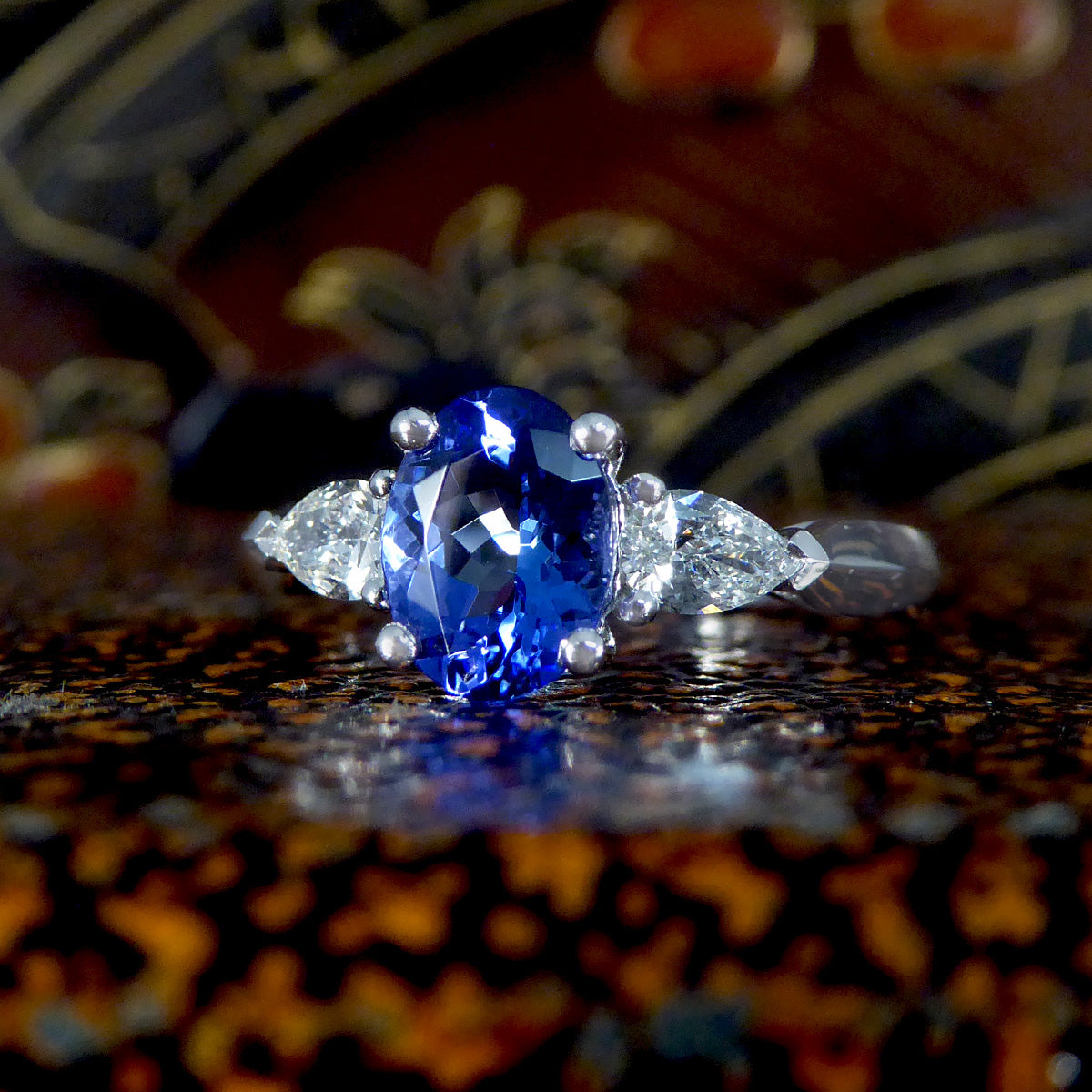 Oval Tanzanite and Pear Cut Diamond Three Stone Ring in Platinum - Wharfedale Antiques