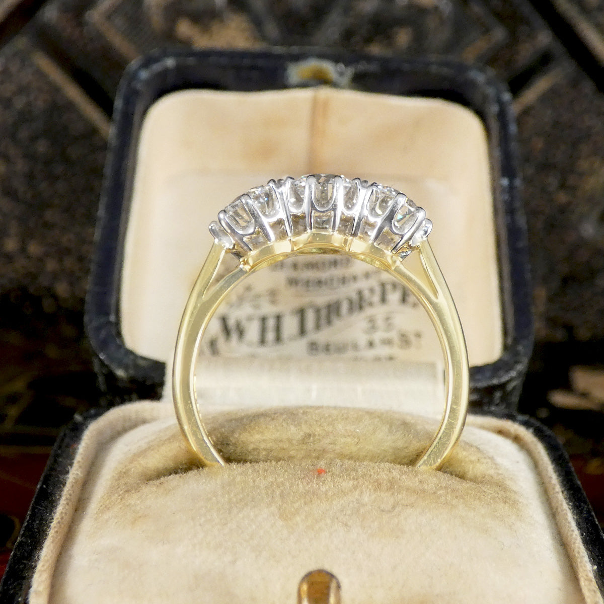 Gold ring with diamonds in a vintage box