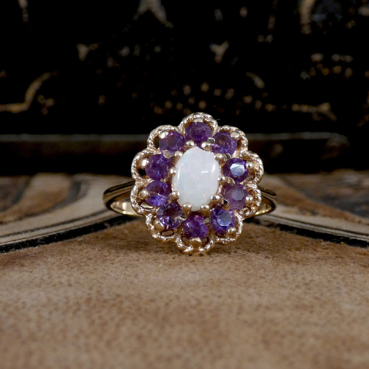 Vintage Opal and Amethyst Cluster Ring in 9ct Yellow Gold with Gold Rope Edge Detail. Amethyst showing bright purple colour with the opal showing a white milky  hue.
