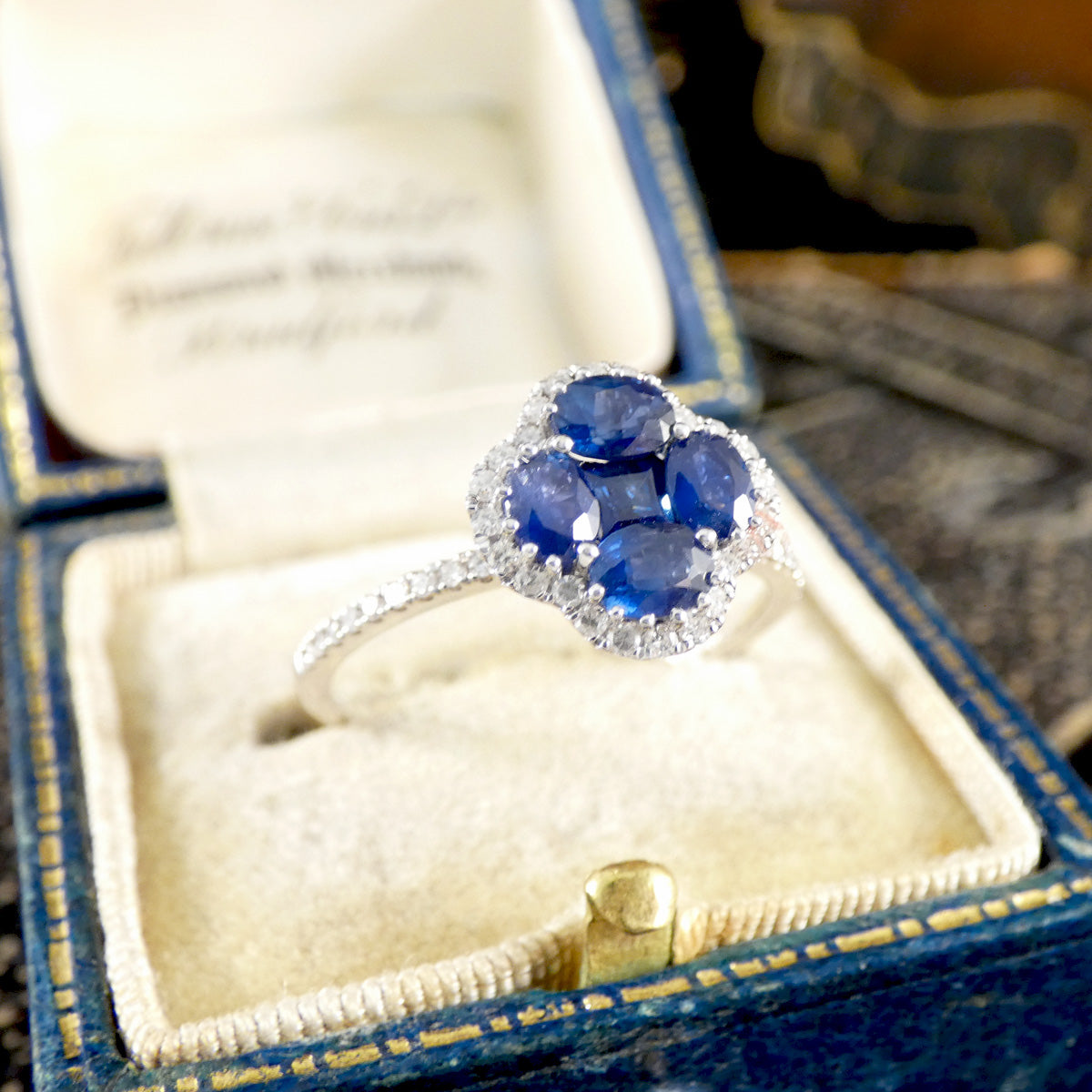 Sapphire and Diamond Shamrock Ring in 18ct White Gold in a jewellery box