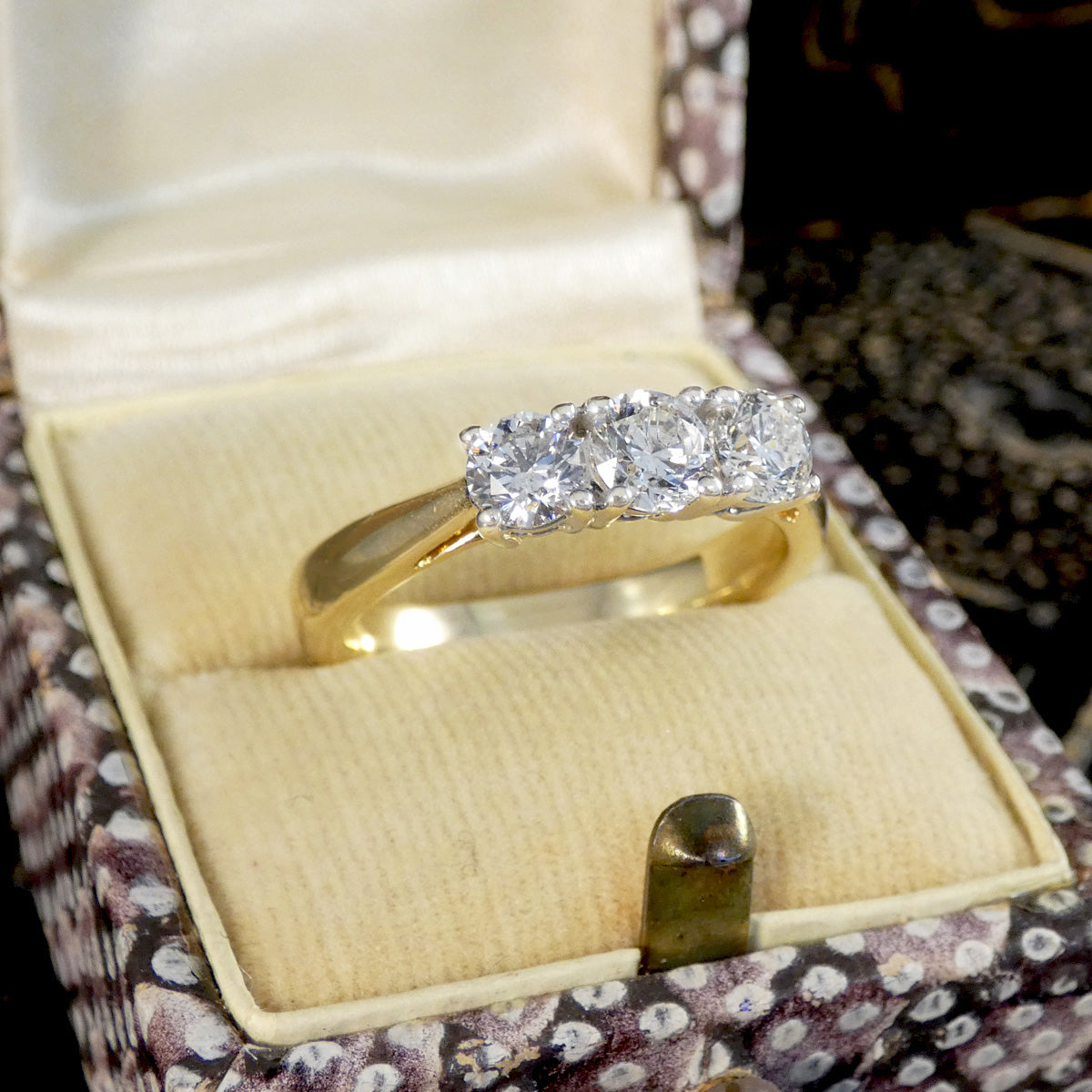 Gold ring with diamonds in a decorative box