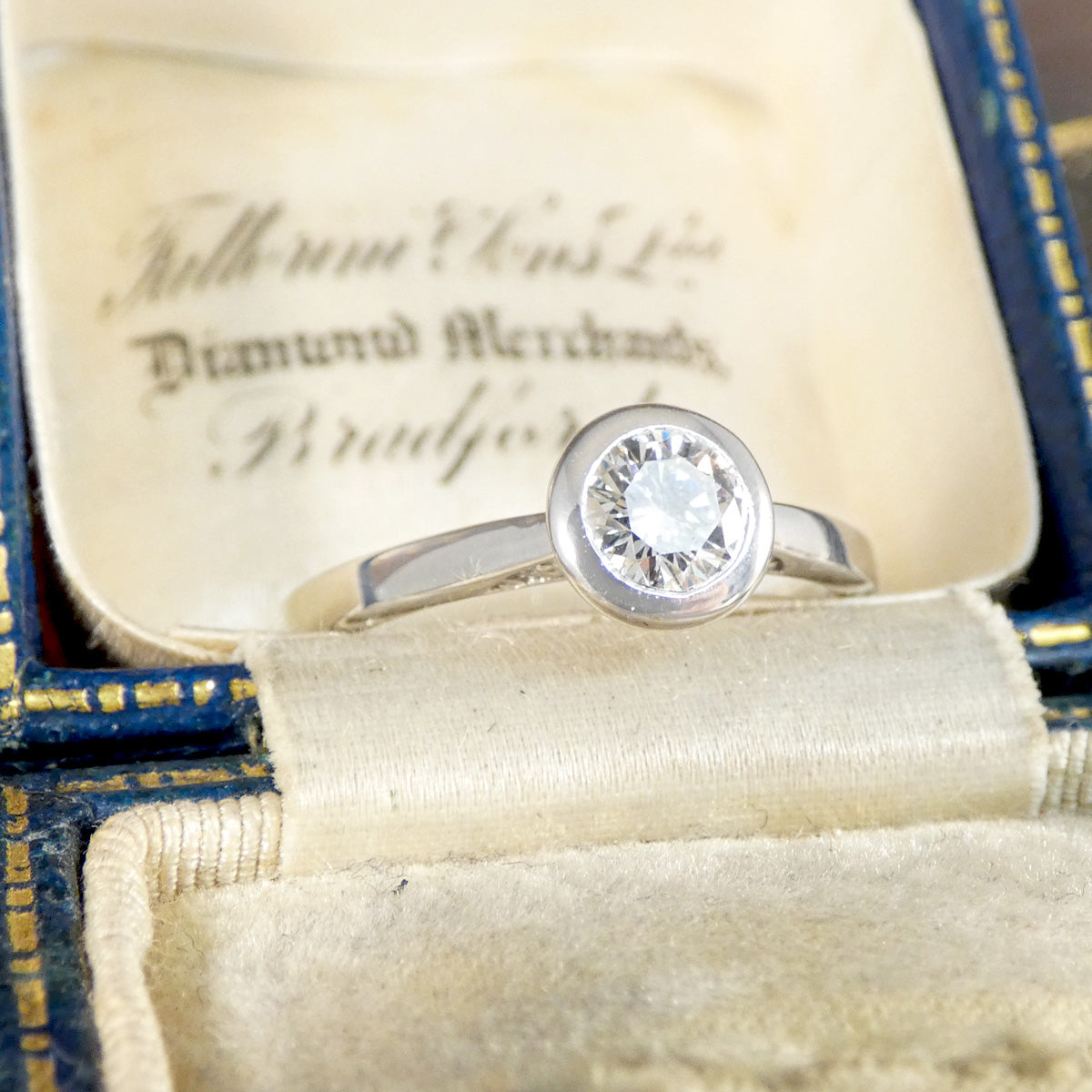 Diamond Solitaire Wedfit Ring in a Rub Over Bezel with a Diamond set Profile