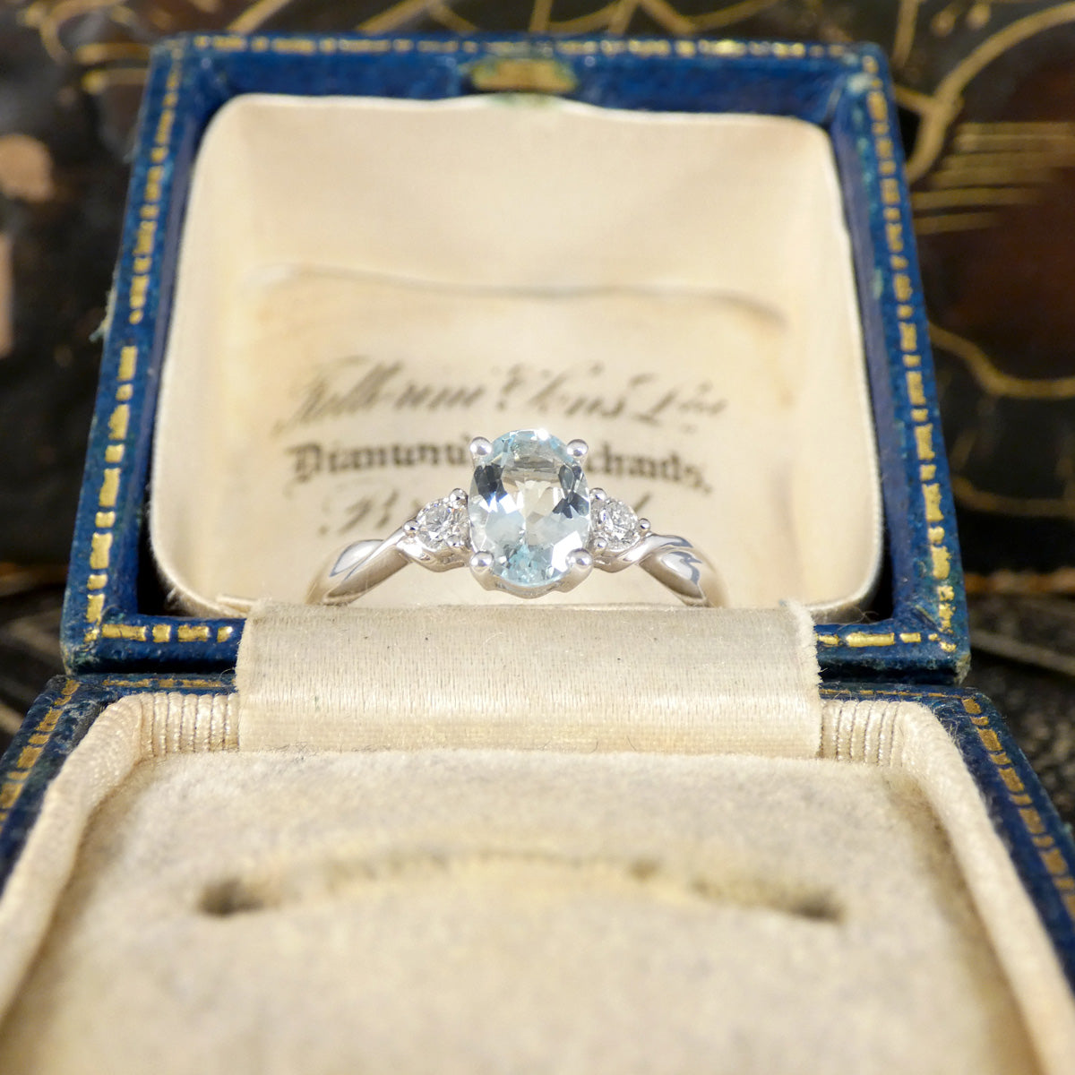 Modern Oval Cut Aquamarine and Brilliant Cut Diamond Three Stone in Platinum the perfect gift and march birthstone.