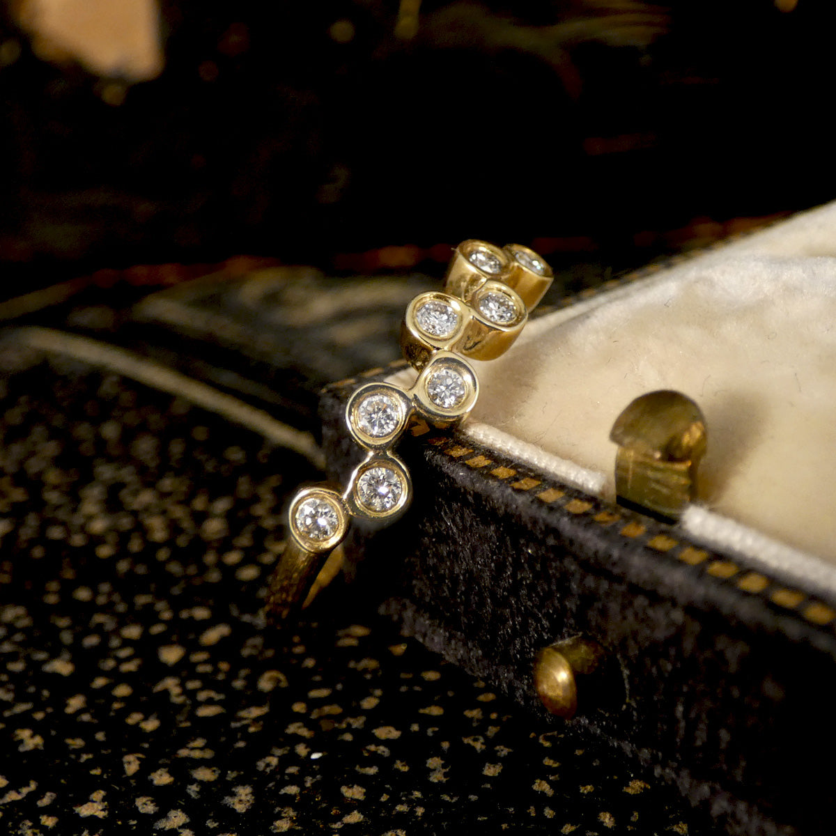 Brilliant cut Diamonds set in a bubbled band in 9ct Yellow Gold. The perfect stackable ring or to be worn solo. Unique and stand out design.