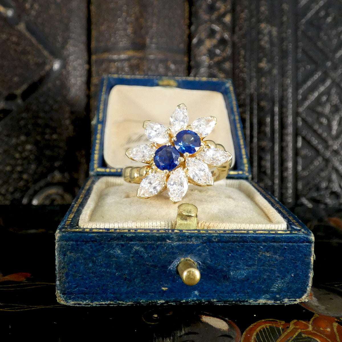 A quality ring designed by Kutchinsky sat in a vintage box.