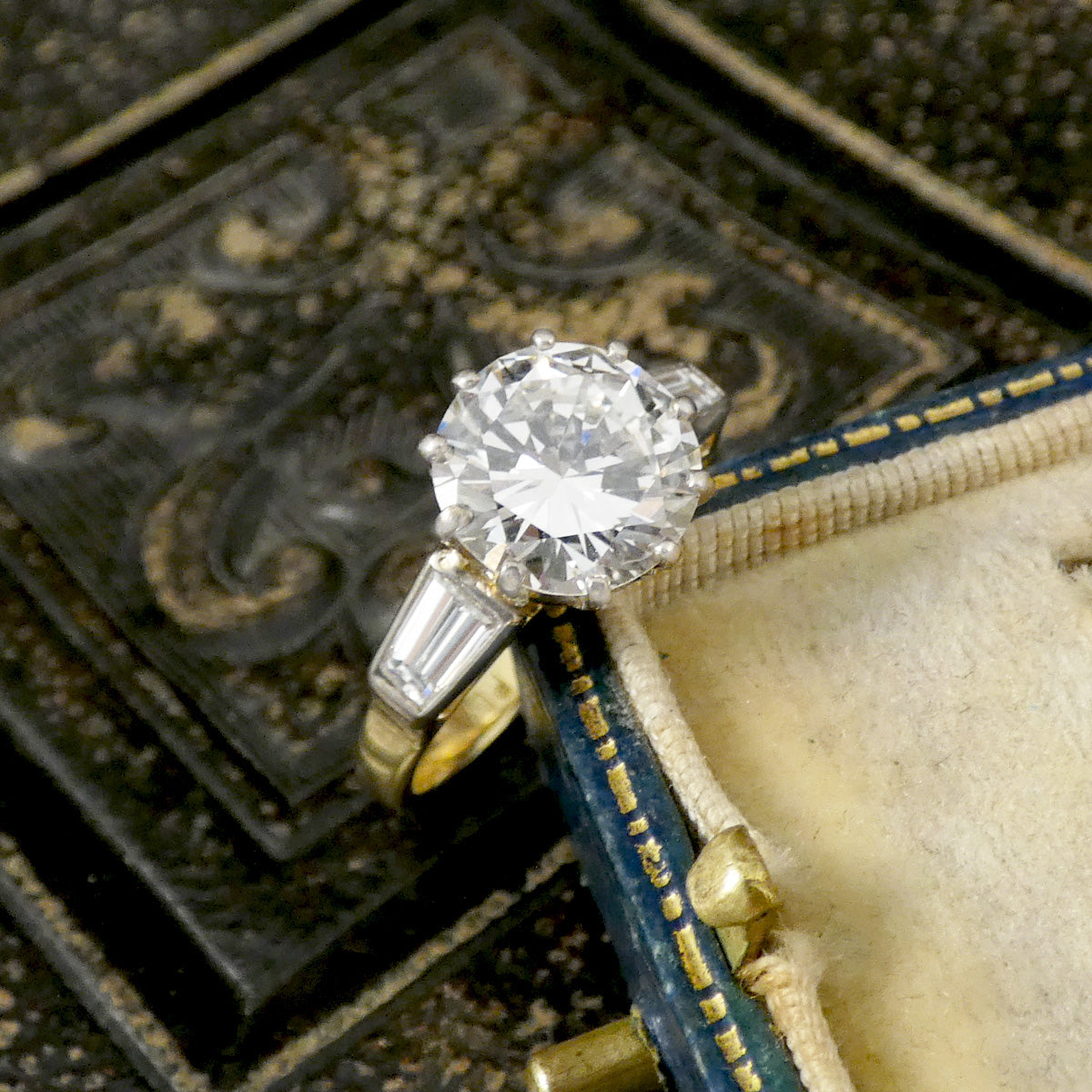 Diamond ring in a decorative jewelry box