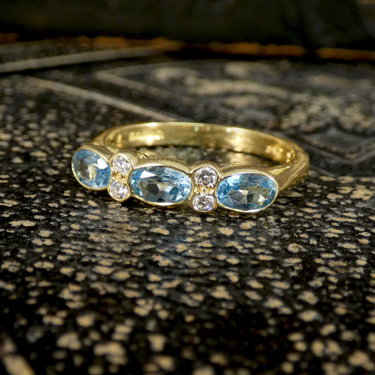 Blue Topaz and Diamonds ring in Yellow Gold