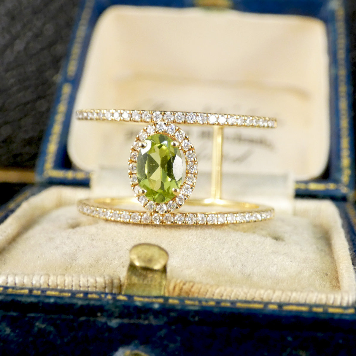 Peridot and Diamond cluster ring with diamond set spacers in 18ct white gold 
