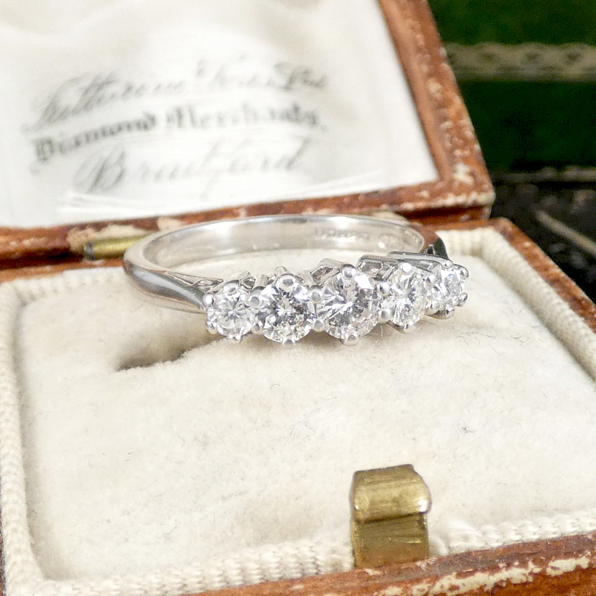 A diamond ring in a vintage box