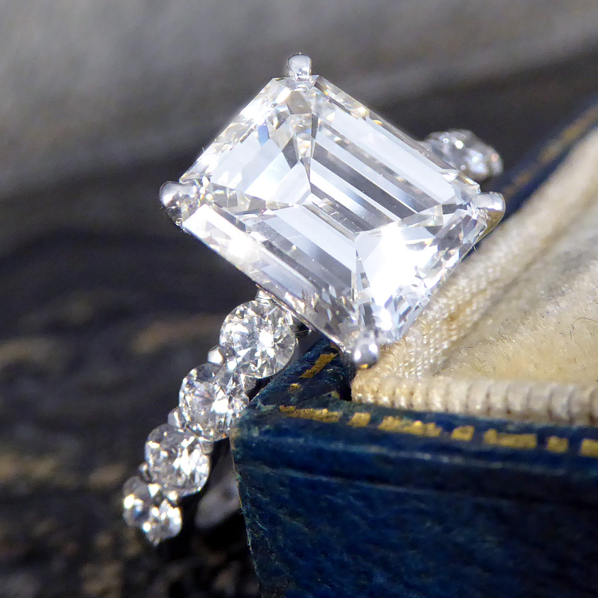 2.60ct Emerald Cut Diamond Solitaire Ring with 0.60ct Diamond Shoulders in Platinum - Wharfedale Antiques